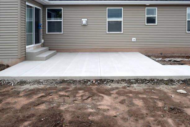 Finished backyard concrete patio with clean broom finish